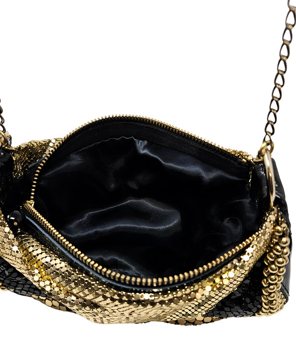 A metallic hobo-style handbag with a black and silver mesh design, accented by large silver beaded trim along the edges. The bag hangs from a silver chain strap and features a soft, slouchy silhouette. Designed by Madison in Beverly Hills