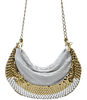 A metallic hobo-style handbag with a black and silver mesh design, accented by large silver beaded trim along the edges. The bag hangs from a silver chain strap and features a soft, slouchy silhouette. Designed by Madison in Beverly Hills