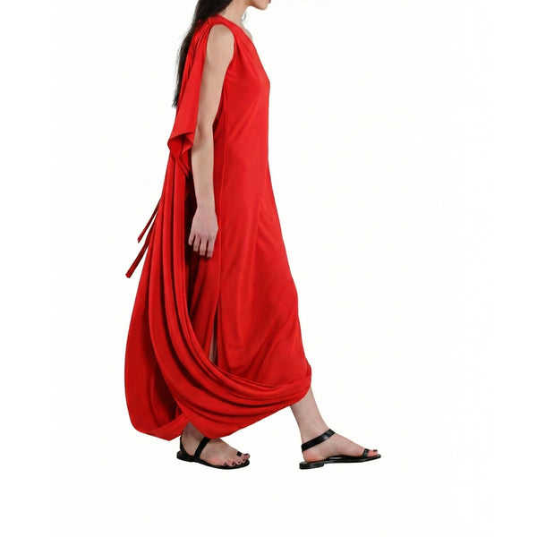 Red dress with a draped design worn by a model on a white background