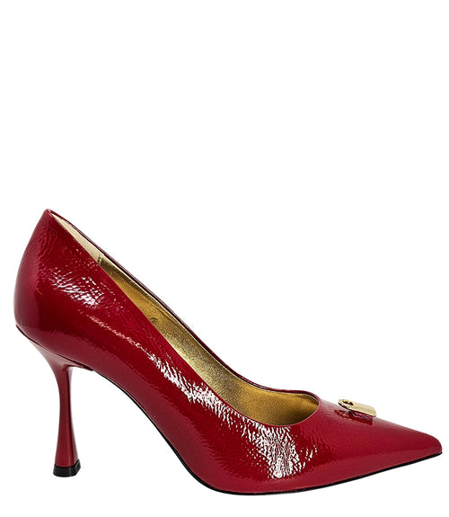 Pointed-toe stiletto pump with a sleek, glossy finish, mid-height heel, and gold lock embellishment at the toe. Features a sculpted silhouette and cushioned interior.