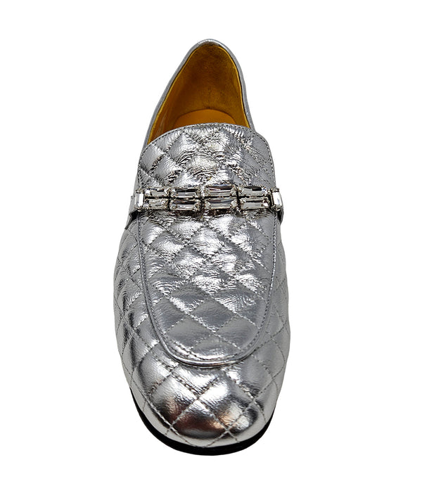 A quilted leather flat loafer with a low stacked heel and rounded toe, featuring a decorative strap adorned with rectangular gemstone-style embellishments. Designed by Madison in Beverly Hills and handcrafted in Italy.