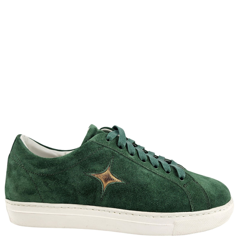 Green suede sneaker with a star detail on a white background
