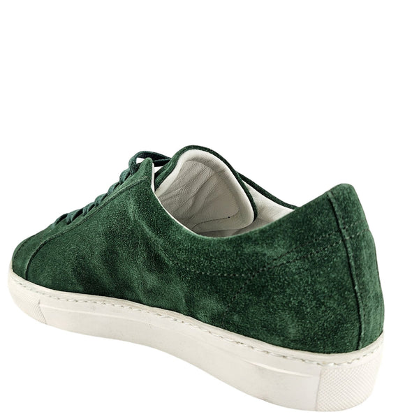 Green suede sneaker on a white background