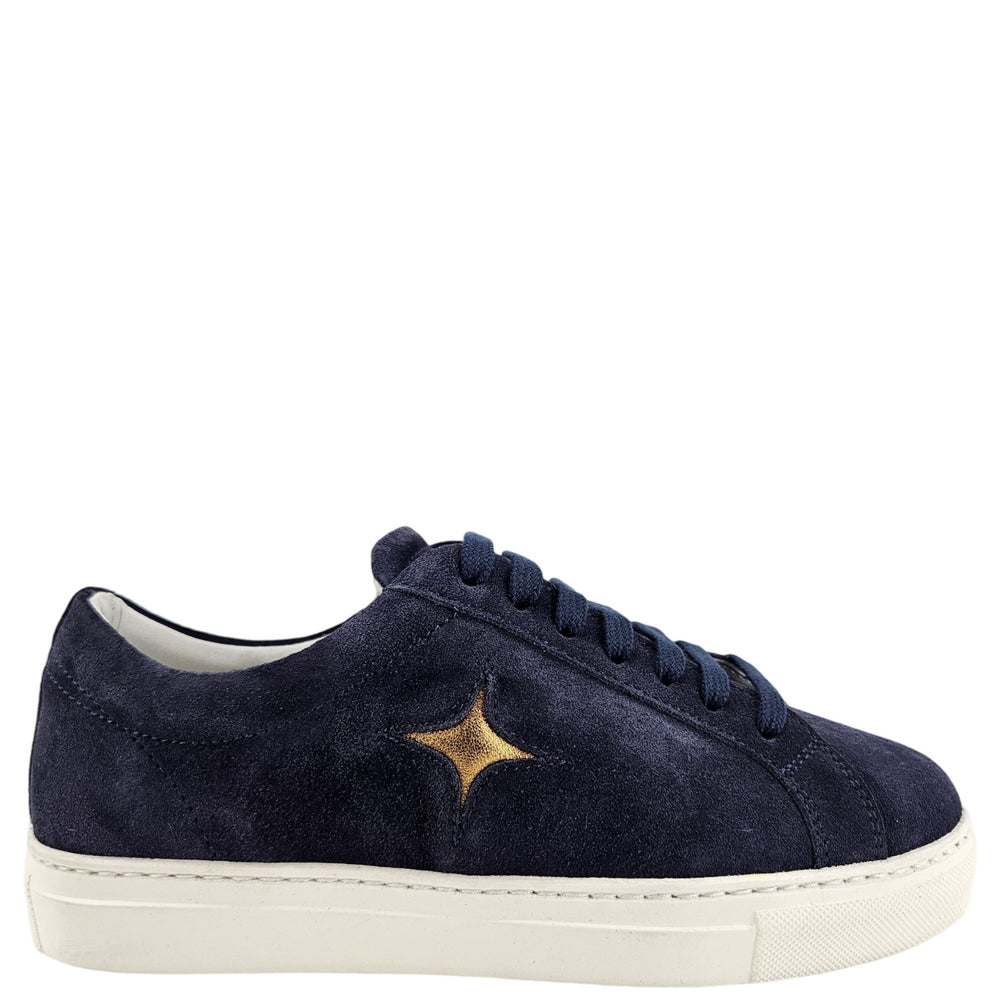 Navy blue suede sneaker with a gold star on a white background