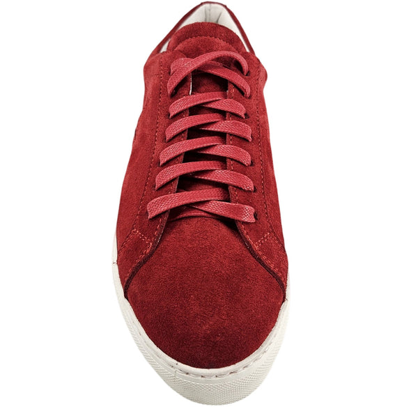 Red sneaker with white sole on a white background