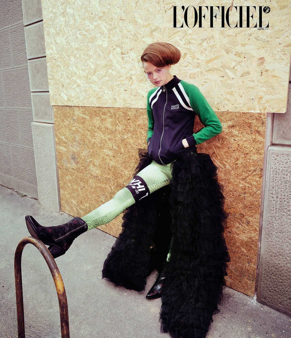 Western-style ankle boot featuring detailed floral embroidery, a pointed toe, side zipper, and angled block heel. Crafted with decorative stitching and a vintage finish.