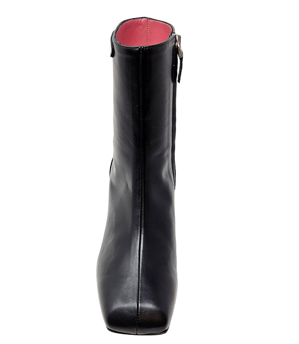 Handcrafted ankle boot made in Italy, designed with a smooth leather finish, square toe, side zipper closure, and a flared block heel. Features a decorative strap with metal accents. Shown from multiple angles against a clean background