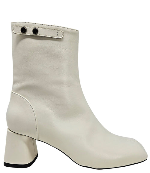 Handcrafted ankle boot made in Italy, designed with a smooth leather finish, square toe, side zipper closure, and a flared block heel. Features a decorative strap with metal accents. Shown from multiple angles against a clean background