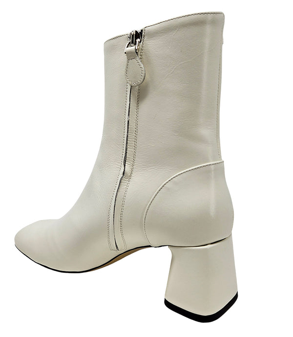 Handcrafted ankle boot made in Italy, designed with a smooth leather finish, square toe, side zipper closure, and a flared block heel. Features a decorative strap with metal accents. Shown from multiple angles against a clean background