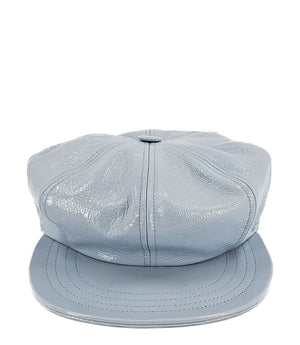 Structured newsboy cap crafted in textured material with panel stitching, a covered button top, and a short curved brim