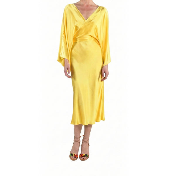 Yellow dress worn by a person on a white background