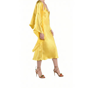 Yellow satin dress with long sleeves on a white background