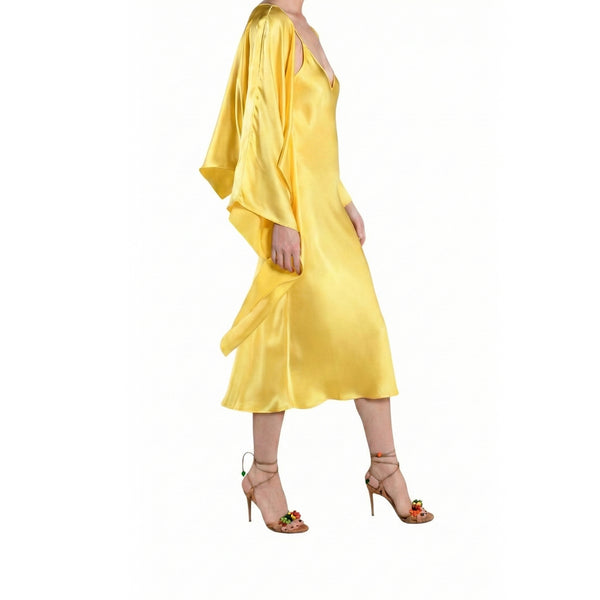 Yellow satin dress with long sleeves on a white background