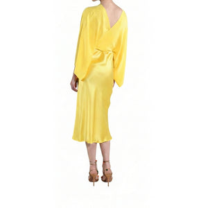 Yellow dress with long sleeves on a white background