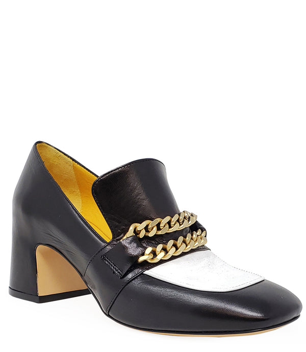 A leather heeled loafer with a block heel and rounded toe, featuring layered chain accents across the upper and a contrasting panel on the vamp. Designed by Madison in Beverly Hills and handcrafted in Italy.