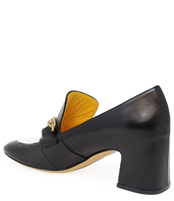 A leather heeled loafer with a block heel and rounded toe, featuring layered chain accents across the upper and a contrasting panel on the vamp. Designed by Madison in Beverly Hills and handcrafted in Italy.