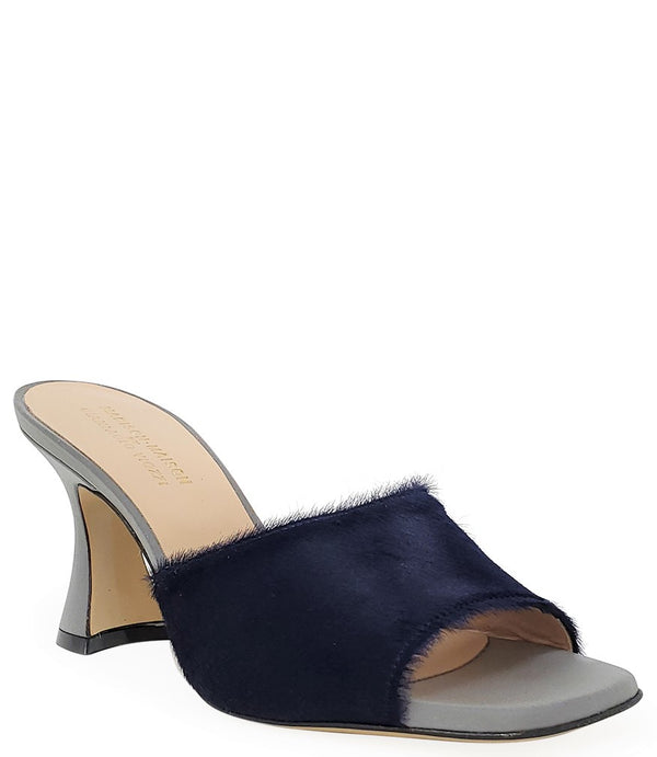 Handcrafted Italian mule with an open toe, flared heel, and a two-tone design. Features a wide vamp strap and cushioned insole for added comfort. Shown from multiple angles against a clean background