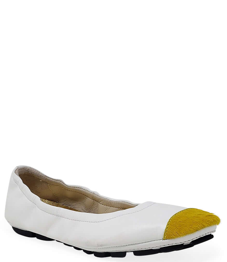 White ballet flat with yellow calf-hair toe tip and black sole