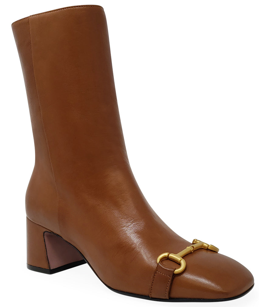 square toe heeled cognac boot with gold horsebit at the toe