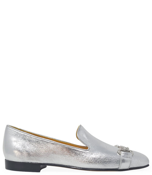 leather loafer with a rounded toe and flat sole, featuring a metal horsebit-style detail across the front. Designed by Madison in Beverly Hills and handcrafted in Italy.