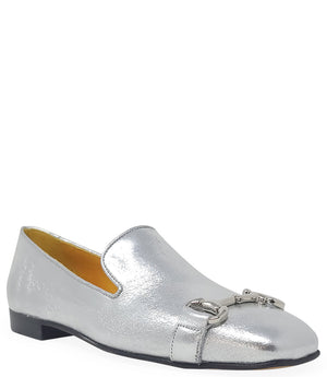 leather loafer with a rounded toe and flat sole, featuring a metal horsebit-style detail across the front. Designed by Madison in Beverly Hills and handcrafted in Italy.