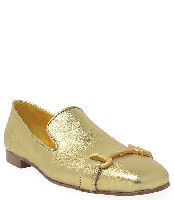 leather loafer with a rounded toe and flat sole, featuring a metal horsebit-style detail across the front. Designed by Madison in Beverly Hills and handcrafted in Italy.