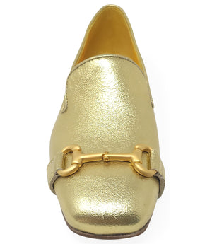 leather loafer with a rounded toe and flat sole, featuring a metal horsebit-style detail across the front. Designed by Madison in Beverly Hills and handcrafted in Italy.