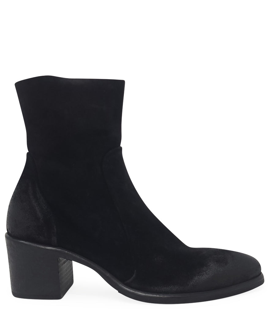 Ankle-height leather boot with a soft sheen finish, block heel, and side zipper closure. Designed with a rounded toe and minimal seam detailing.