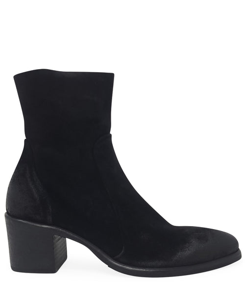 Ankle-height leather boot with a soft sheen finish, block heel, and side zipper closure. Designed with a rounded toe and minimal seam detailing.