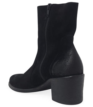 Ankle-height leather boot with a soft sheen finish, block heel, and side zipper closure. Designed with a rounded toe and minimal seam detailing.
