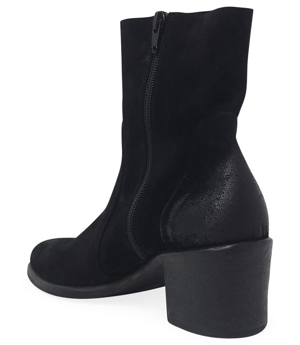 Ankle-height leather boot with a soft sheen finish, block heel, and side zipper closure. Designed with a rounded toe and minimal seam detailing.