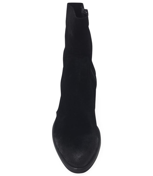 Ankle-height leather boot with a soft sheen finish, block heel, and side zipper closure. Designed with a rounded toe and minimal seam detailing.