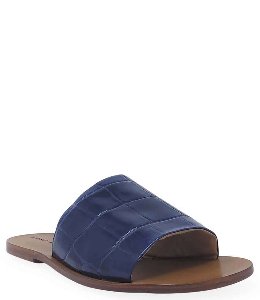 Blue open-toe slide sandal, dark blue crocodile-texture upper, brown sole.