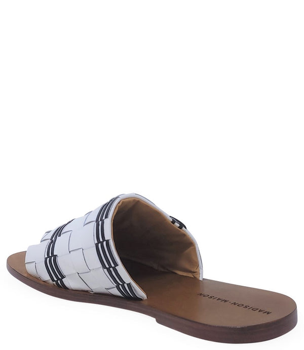 Handmade Italian slide sandal featuring a wide woven upper with interlaced detailing and a flat leather sole. Shown from side and front angles against a clean background.