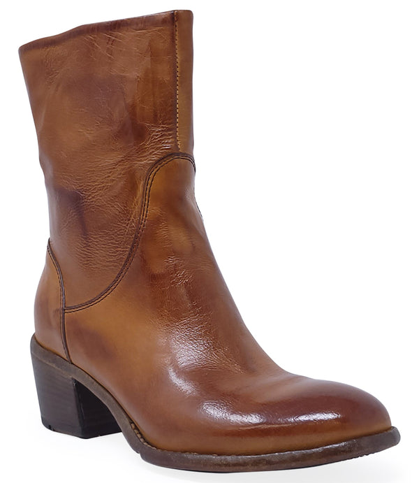 Mid-calf leather boot with rounded toe, block heel, and natural creasing for a worn-in effect. Features minimal seam detailing