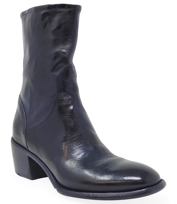 Mid-calf leather boot with rounded toe, block heel, and natural creasing for a worn-in effect. Features minimal seam detailing