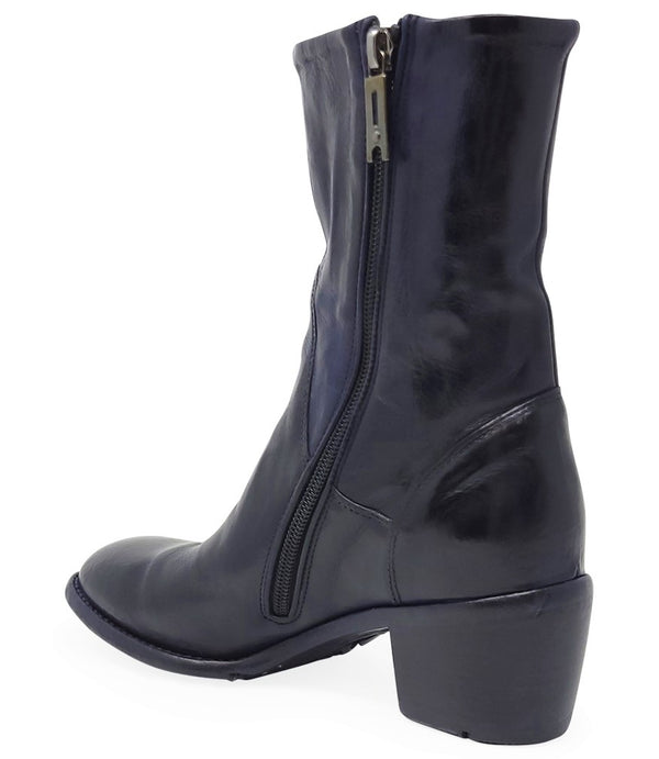 Mid-calf leather boot with rounded toe, block heel, and natural creasing for a worn-in effect. Features minimal seam detailing