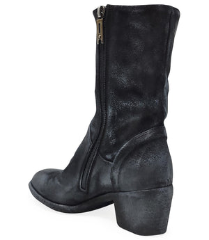 Mid-calf boot with a matte distressed finish, block heel, and rounded toe. Features a relaxed shaft and minimal seam lines.
