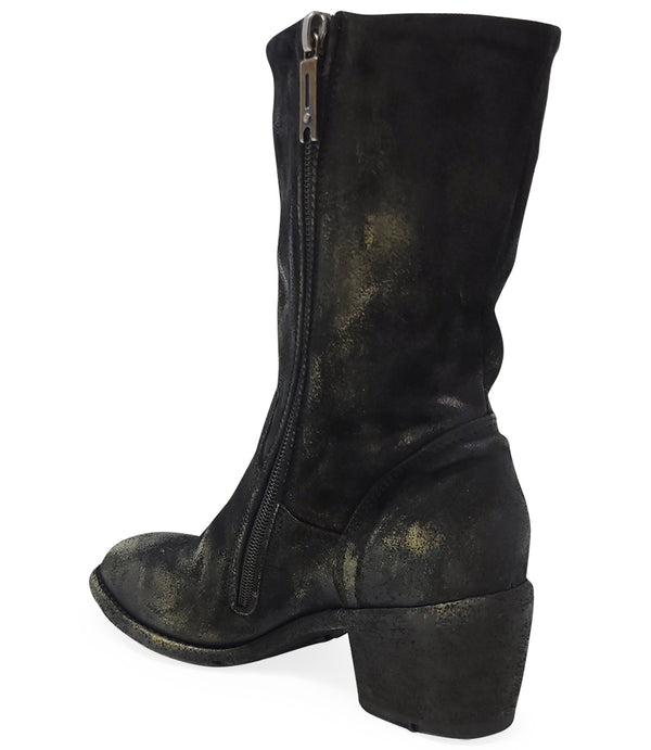 Mid-calf boot with a matte distressed finish, block heel, and rounded toe. Features a relaxed shaft and minimal seam lines.