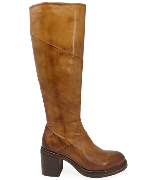 "Knee-high leather boot with structured shaft, rounded toe, and stacked block heel. Designed with minimal stitching and a smooth finish
