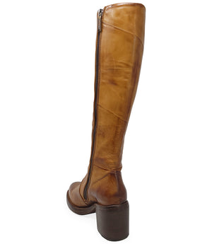 "Knee-high leather boot with structured shaft, rounded toe, and stacked block heel. Designed with minimal stitching and a smooth finish