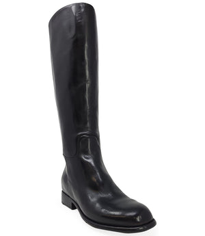 "Knee-high leather boot with structured shaft, rounded toe, and stacked block heel. Designed with minimal stitching and a smooth finish