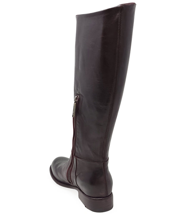 "Knee-high leather boot with structured shaft, rounded toe, and stacked block heel. Designed with minimal stitching and a smooth finish