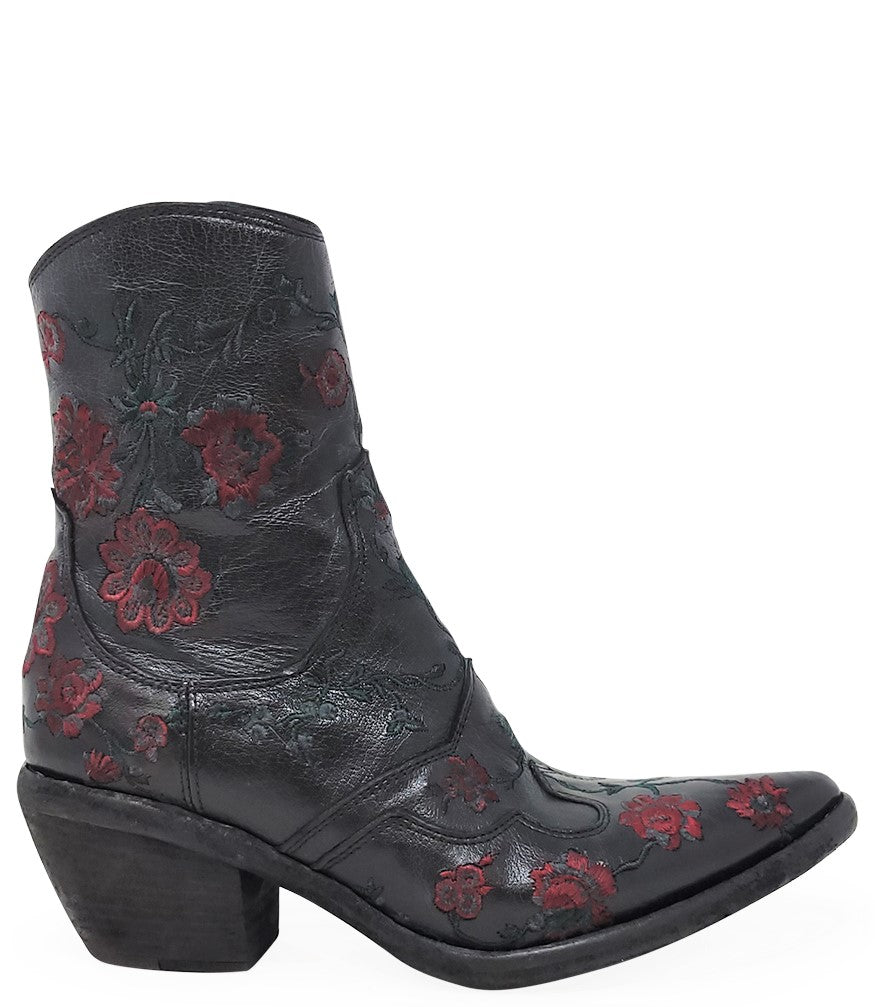 Western-style ankle boot featuring detailed floral embroidery, a pointed toe, side zipper, and angled block heel. Crafted with decorative stitching and a vintage finish.