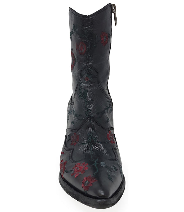 Western-style ankle boot featuring detailed floral embroidery, a pointed toe, side zipper, and angled block heel. Crafted with decorative stitching and a vintage finish.