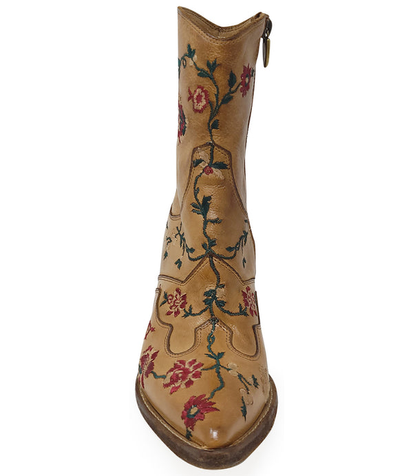Western-style ankle boot featuring detailed floral embroidery, a pointed toe, side zipper, and angled block heel. Crafted with decorative stitching and a vintage finish.