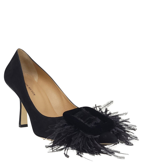Pointed-toe pump crafted from soft suede with a mid-height stiletto heel, featuring a dramatic feather and velvet buckle embellishment across the toe. Designed with a leather-lined interior and a durable leather outsole for lasting comfort and support. El