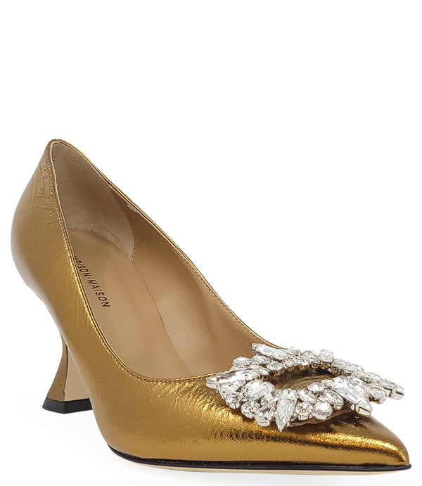 Pointed-toe pump crafted from premium leather with a softly crinkled finish, featuring an embellished jeweled buckle at the toe and a sculpted flared kitten heel. Designed with a leather-lined interior and a leather outsole for comfort and durability. Ele