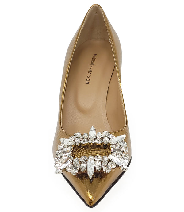 Pointed-toe pump crafted from premium leather with a softly crinkled finish, featuring an embellished jeweled buckle at the toe and a sculpted flared kitten heel. Designed with a leather-lined interior and a leather outsole for comfort and durability. Ele