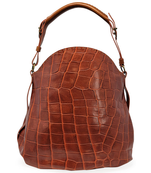 "Large hobo-style shoulder bag crafted from premium leather with an all-over crocodile-embossed texture. Features a wide, adjustable leather shoulder strap with metal hardware and an open top for easy access. Softly structured body designed for a relaxed